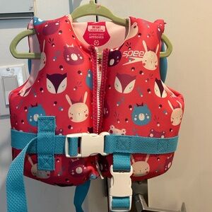 Pink Speedo floatie for under 30 lbs. never used